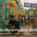alt_text: Mural berwarna-warni di tembok kota, menampilkan jejak megalit Palu, festival 2026.